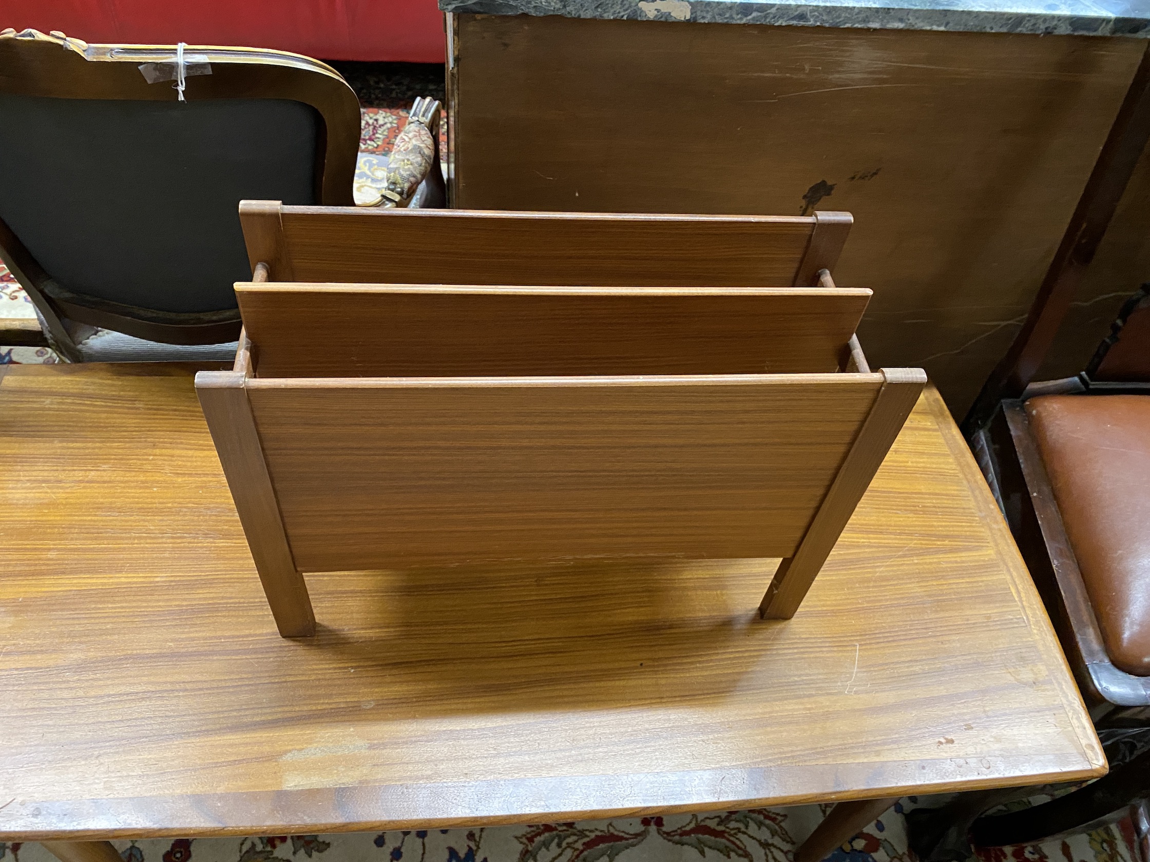 A mid century rectangular teak coffee table, length 118cm, depth 65cm, height 44cm together with a mid century teak magazine rack